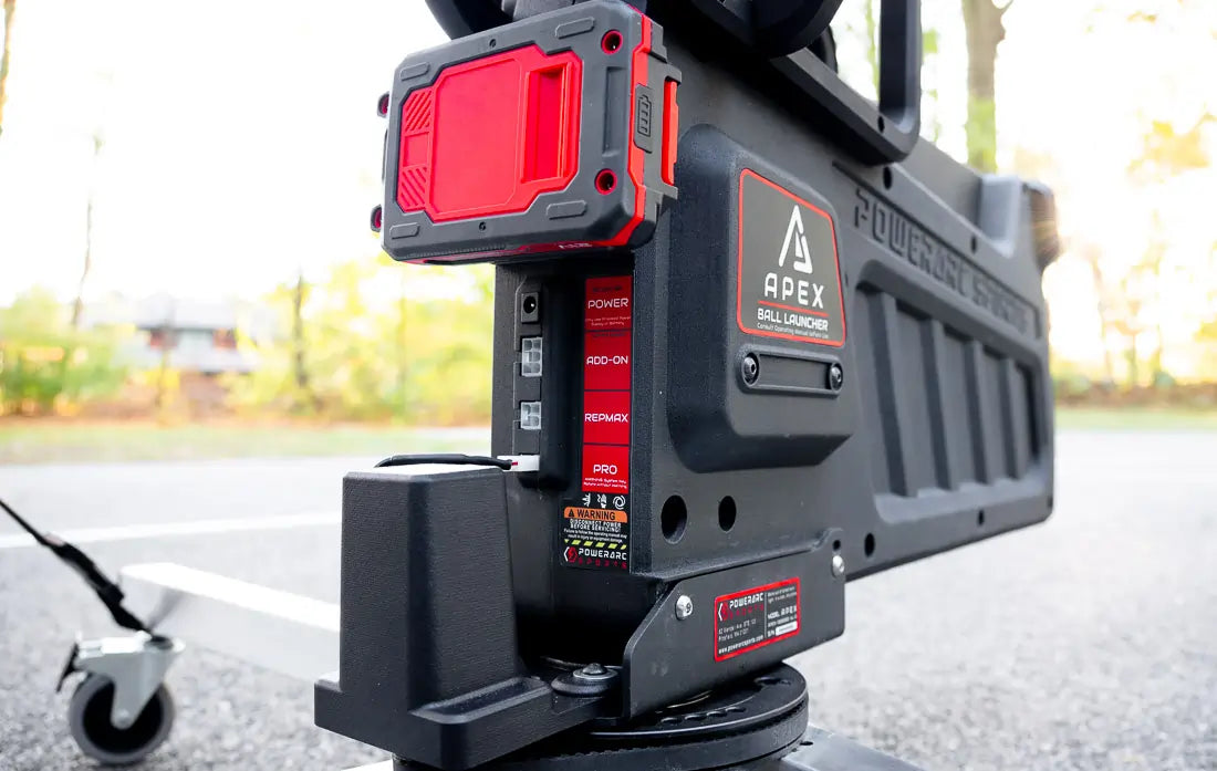 tight crop of back side of apex shooting machine showing ports