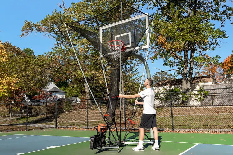 man rolls apex onto basketball court for quick setup in 90 seconds