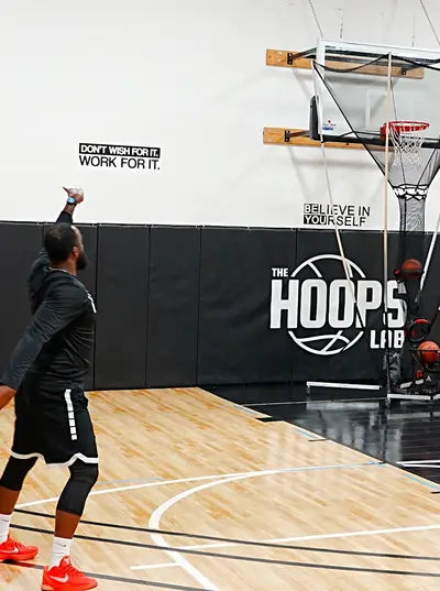 man shooting a 3 point shot with apex shooting machine