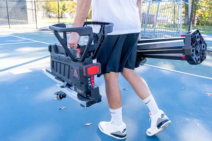 person carrying apex shooting machine with two hands